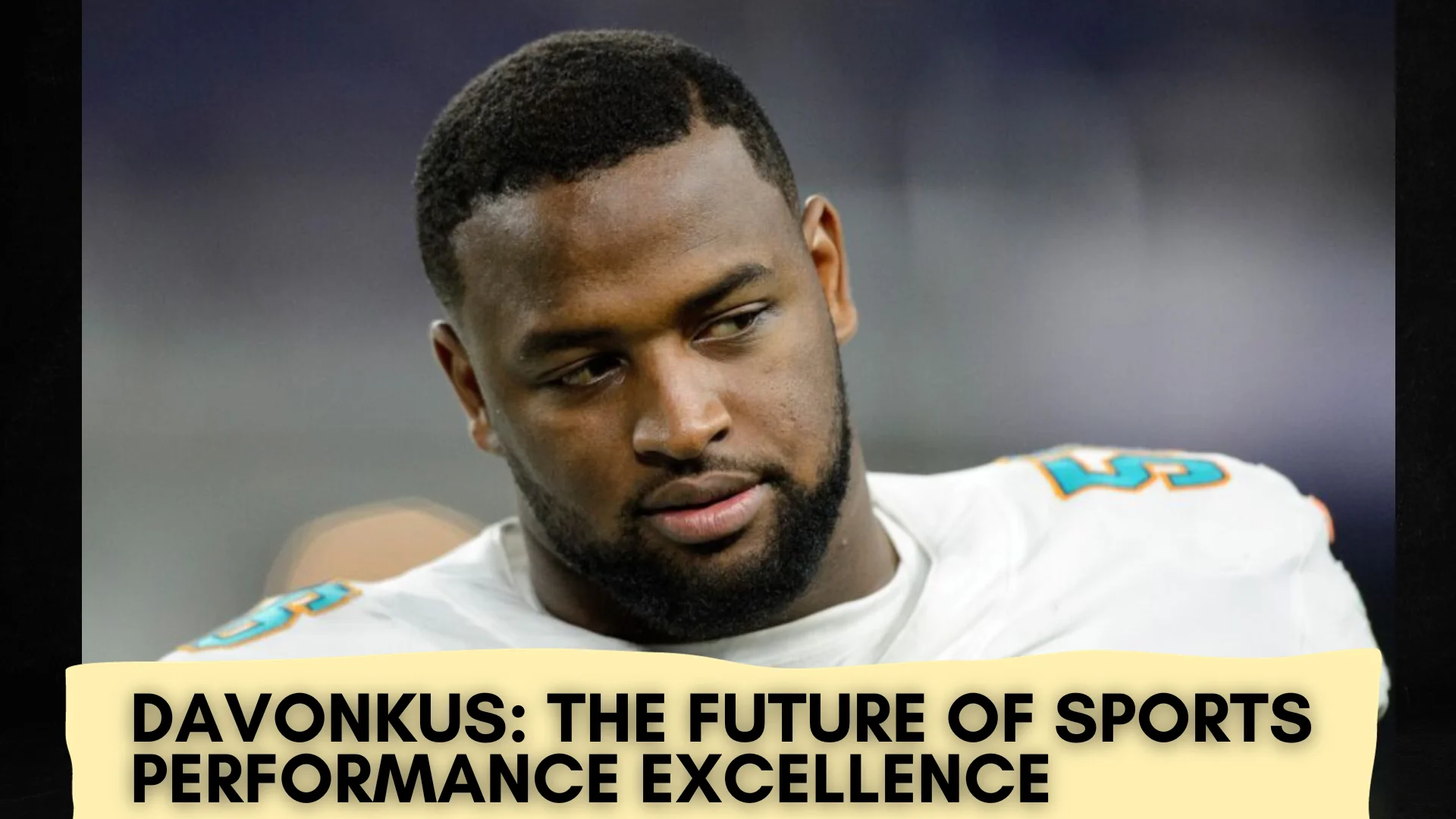 The image depicts a close-up of an athlete, presumably a professional football player, as suggested by the shoulder pads under his jersey. The jersey features a prominent number and possibly a team logo, although the details are not clear. The athlete has a focused and serious expression, suggesting contemplation or determination. Overlaying the photo is a banner with the text "DAVONKUS: THE FUTURE OF SPORTS PERFORMANCE EXCELLENCE," indicating that the individual is being highlighted for his potential and expected impact in the sports field. The choice of bold, capitalized font for the text conveys importance and confidence in the athlete's capabilities. The overall composition of the image serves to present the athlete as a significant figure in the context of sports performance.